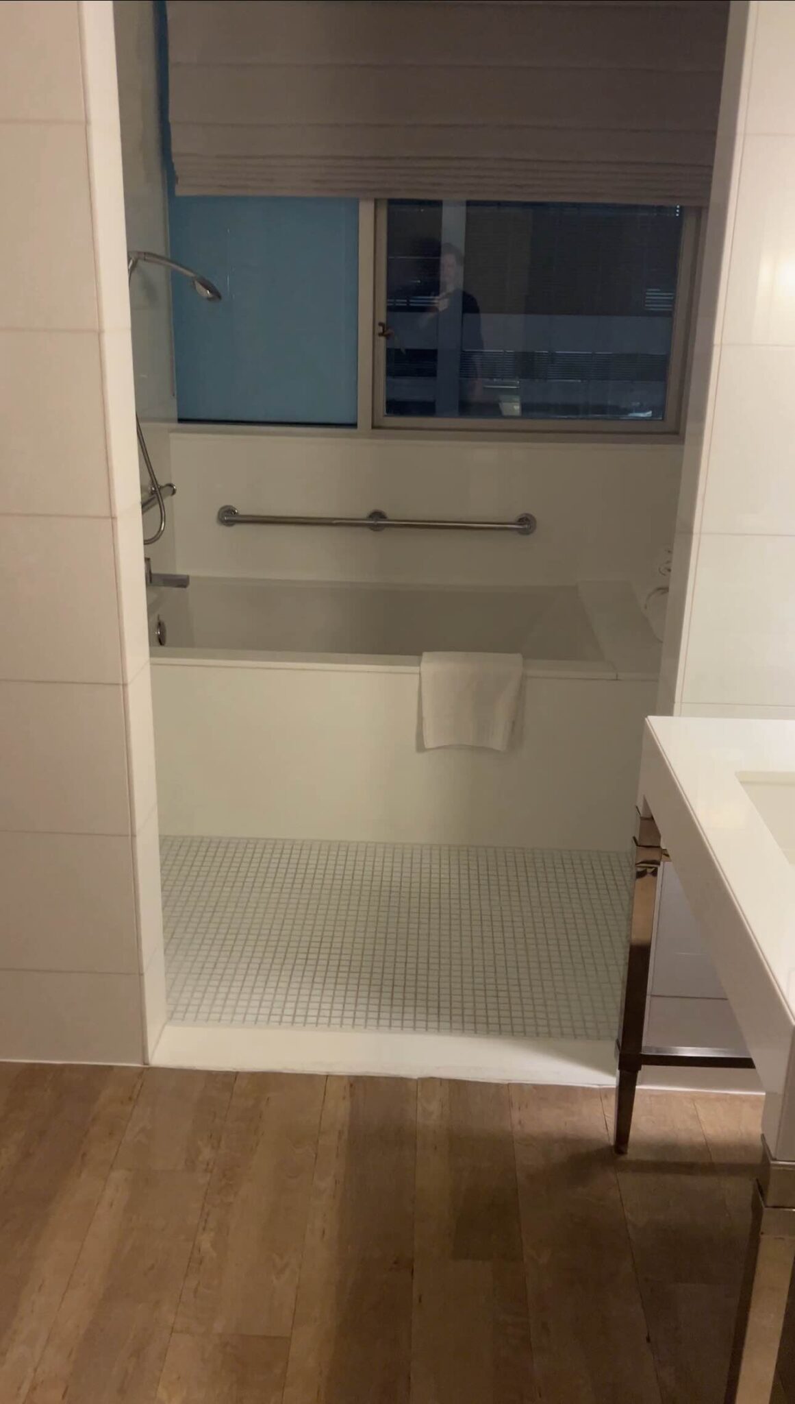 a bathroom with a bathtub and a sink