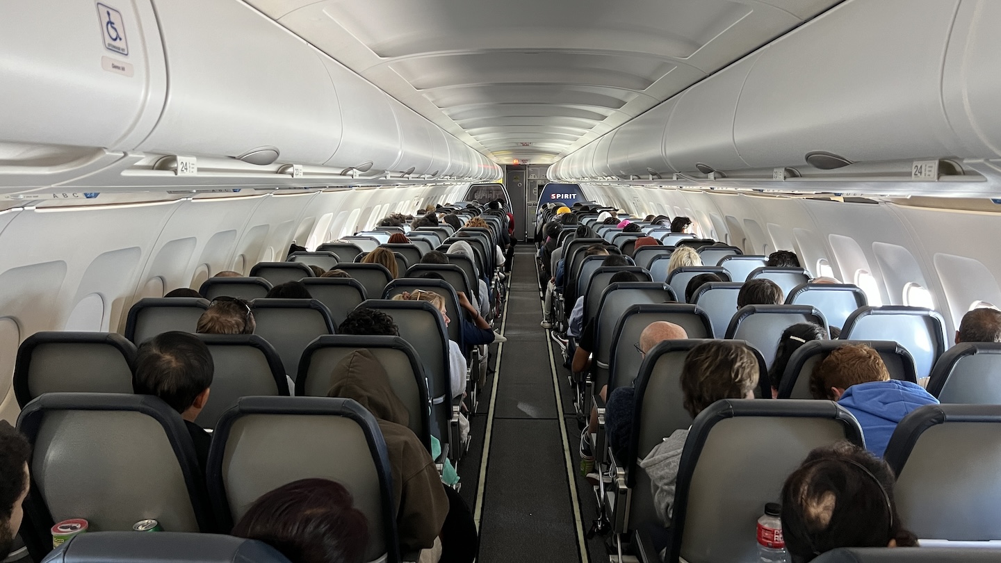 a group of people sitting in an airplane