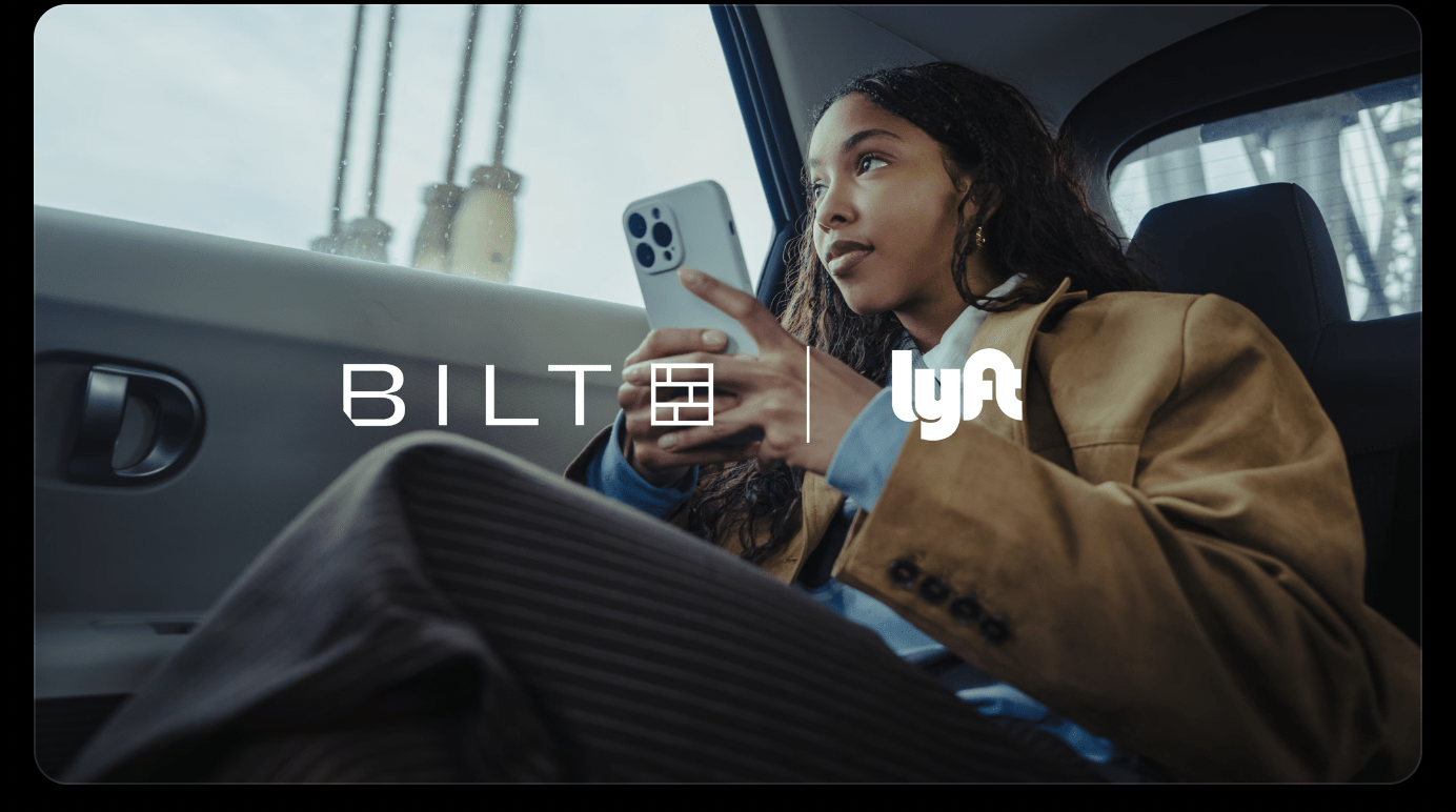 a woman holding a phone in a car