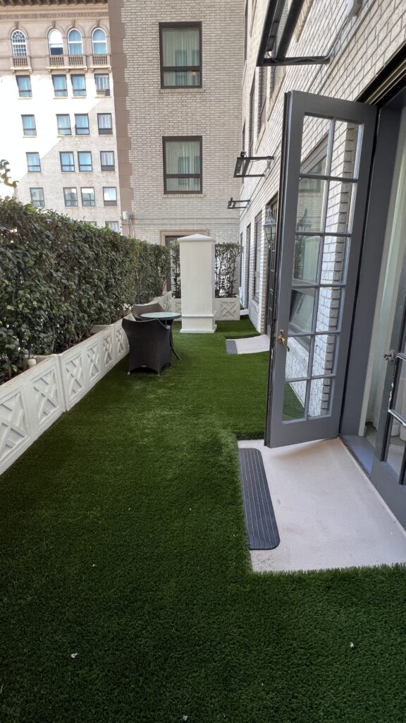 a patio with a table and chairs