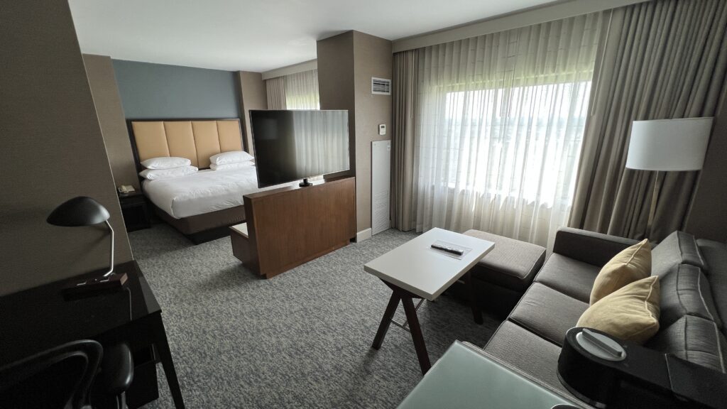 a room with a tv and couches