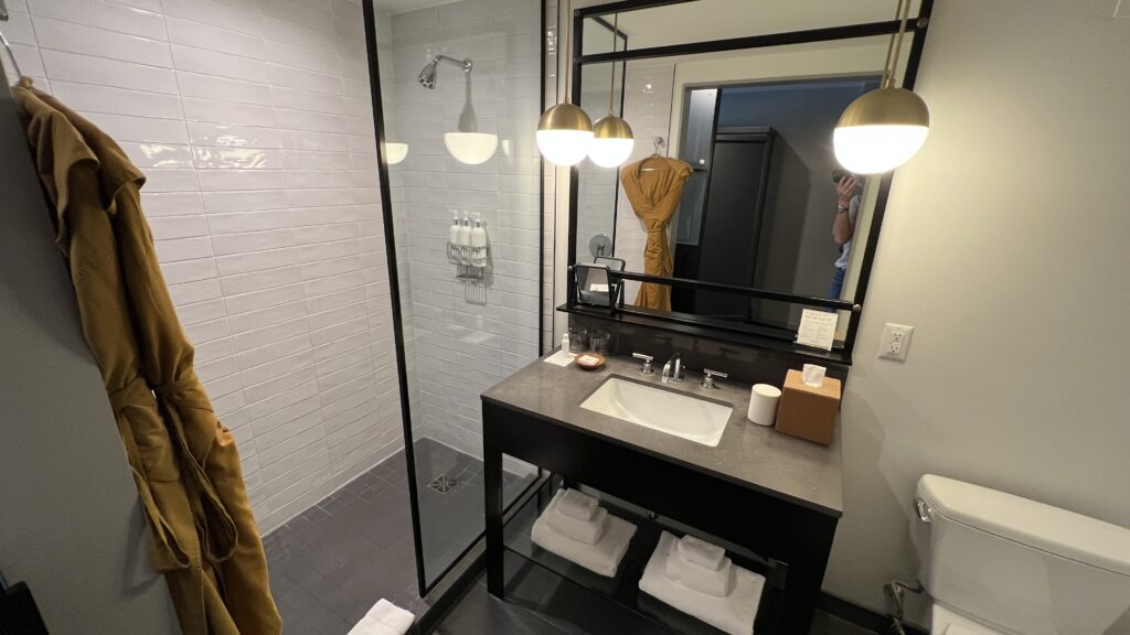 a bathroom with a mirror and sink