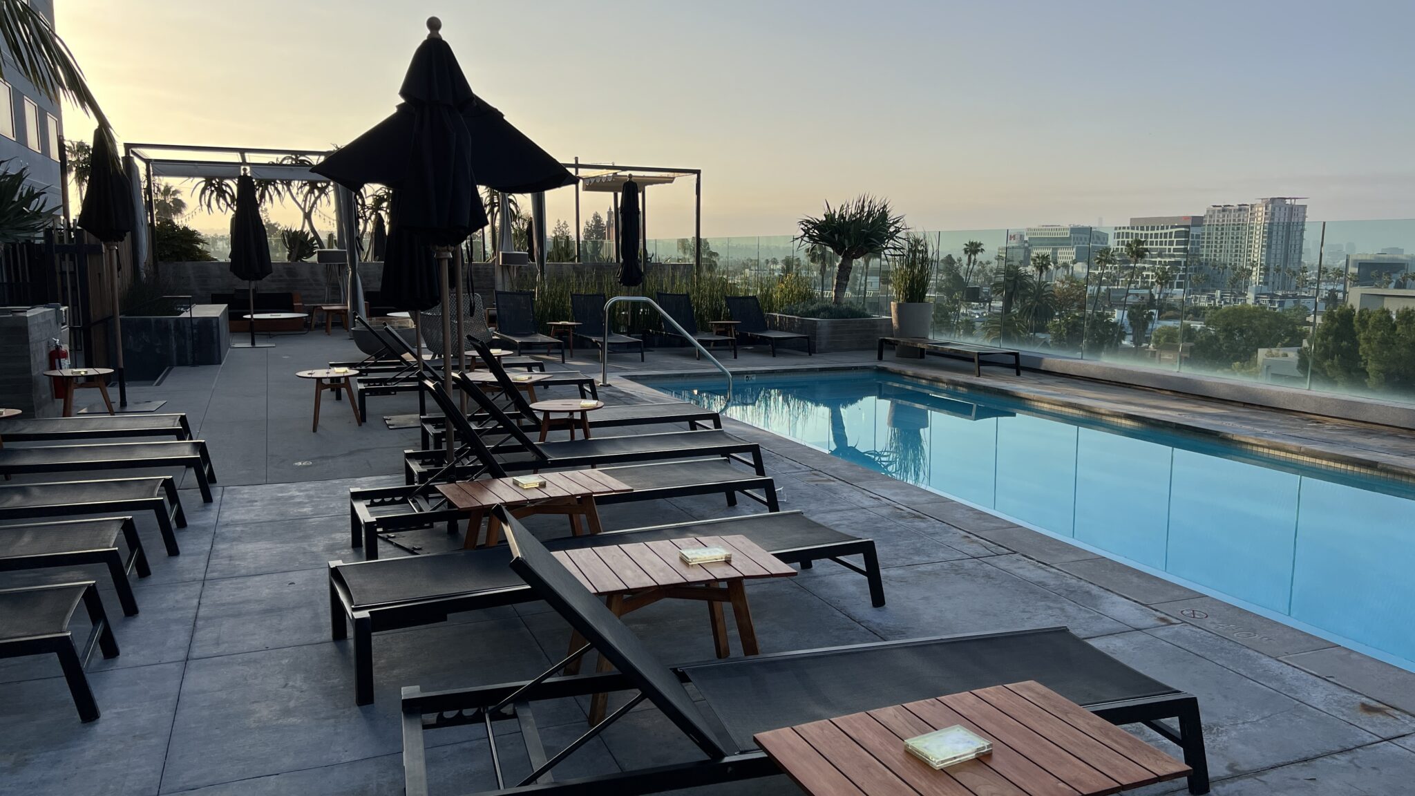 a pool with chairs and umbrellas