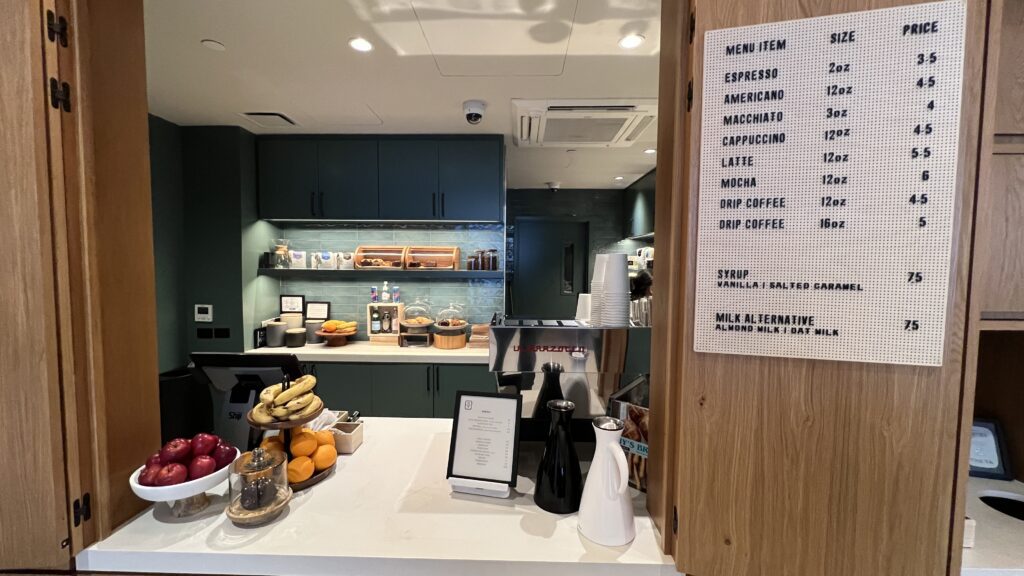 a counter with a menu and a coffee machine