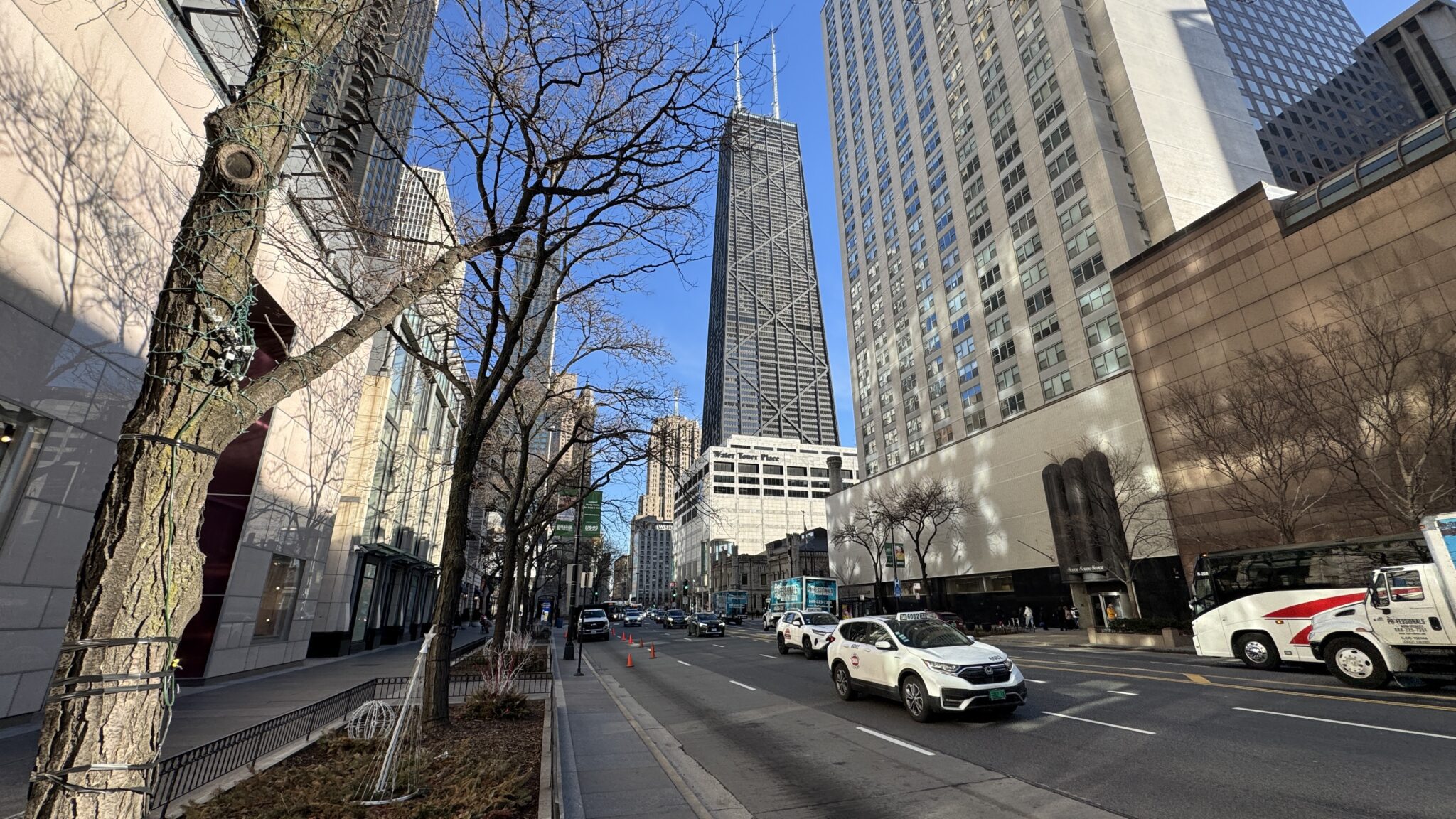 a street with cars and buildings