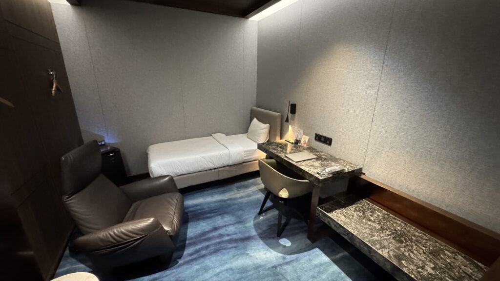 a room with a bed and a desk