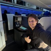 a man taking a selfie in an airplane