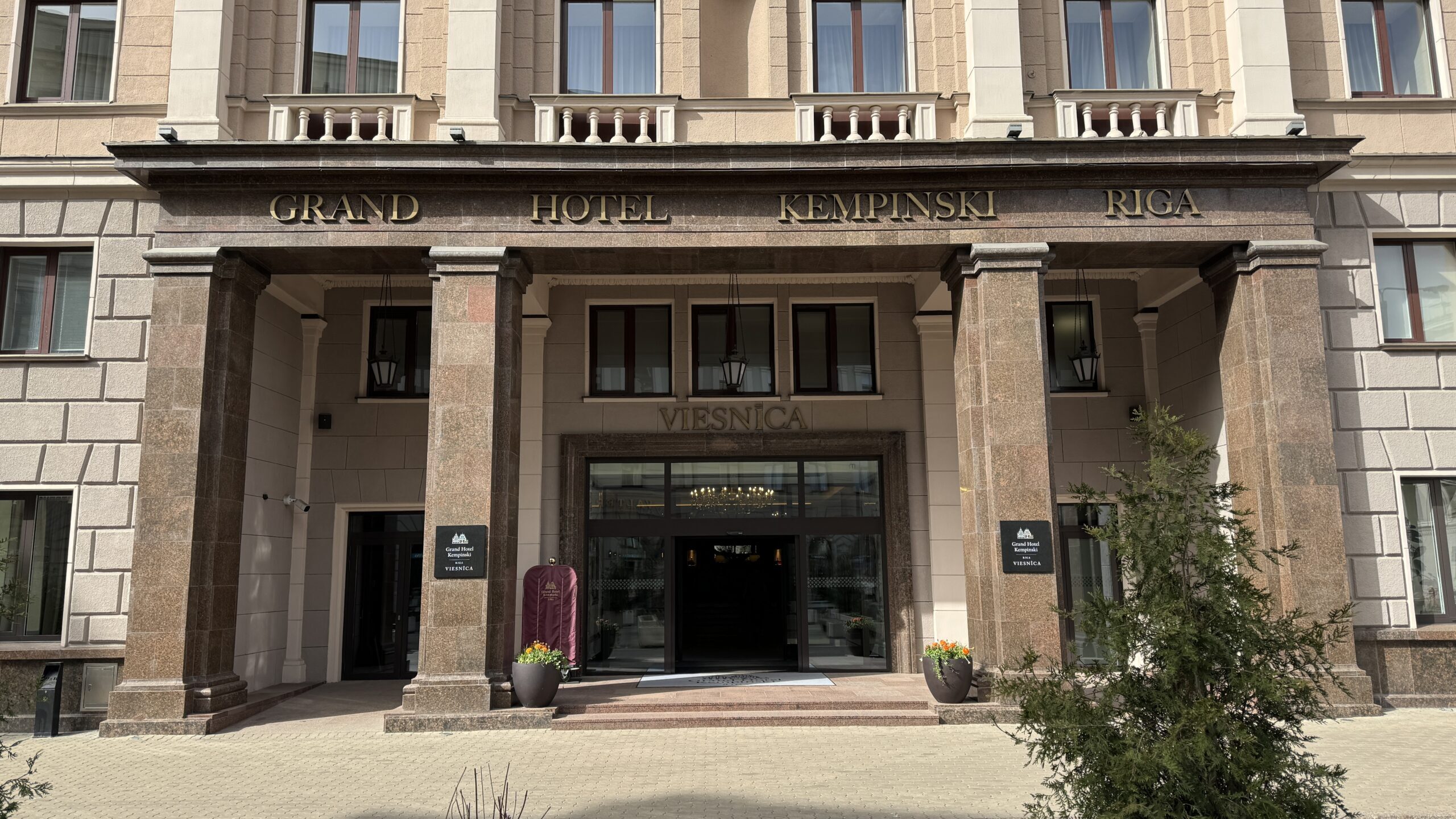 a building with columns and a sign