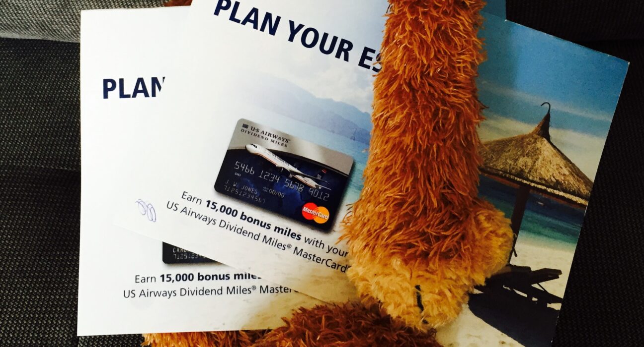 a stuffed animal with a credit card and a credit card on it