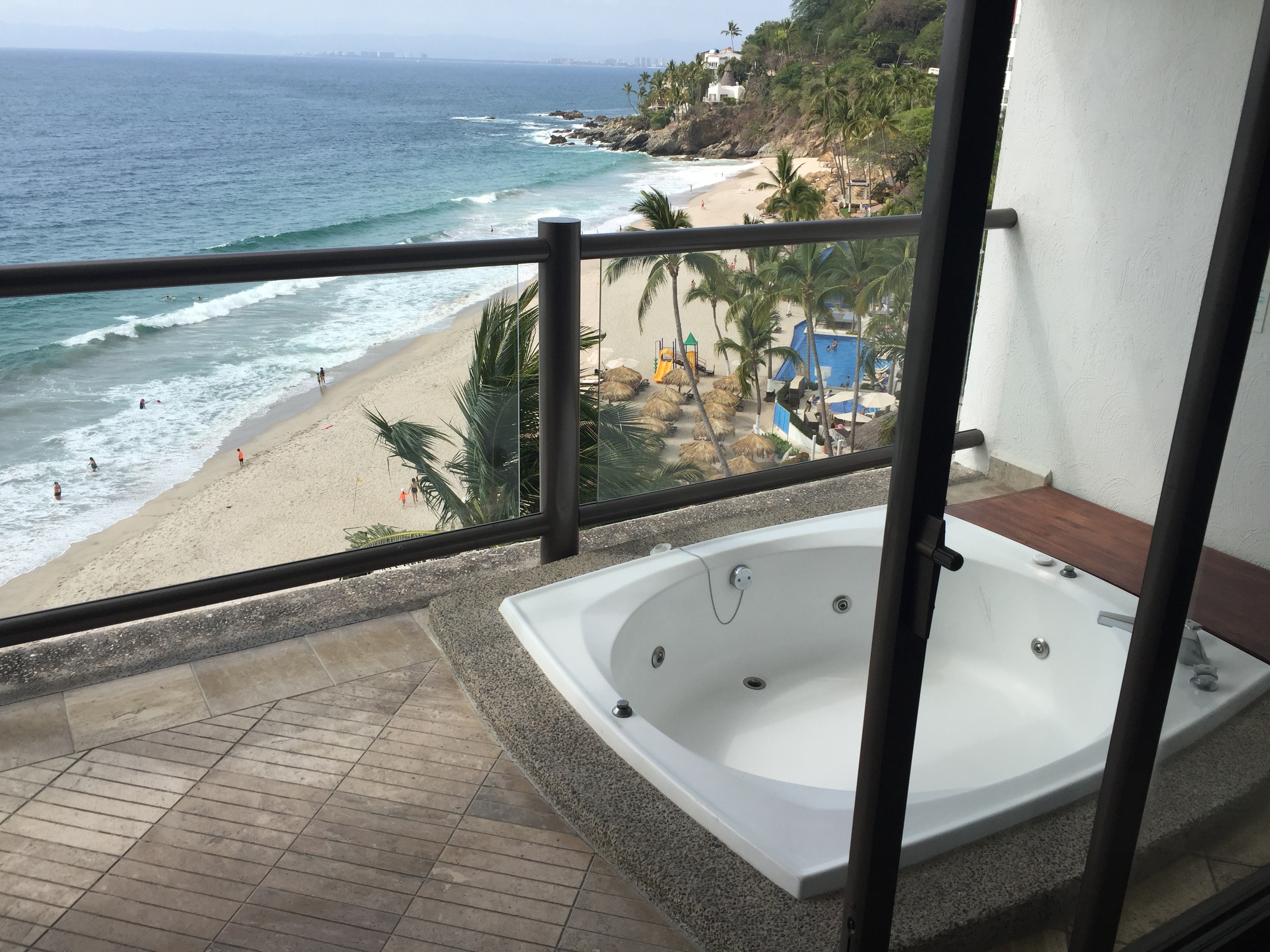 a bathtub overlooking a beach