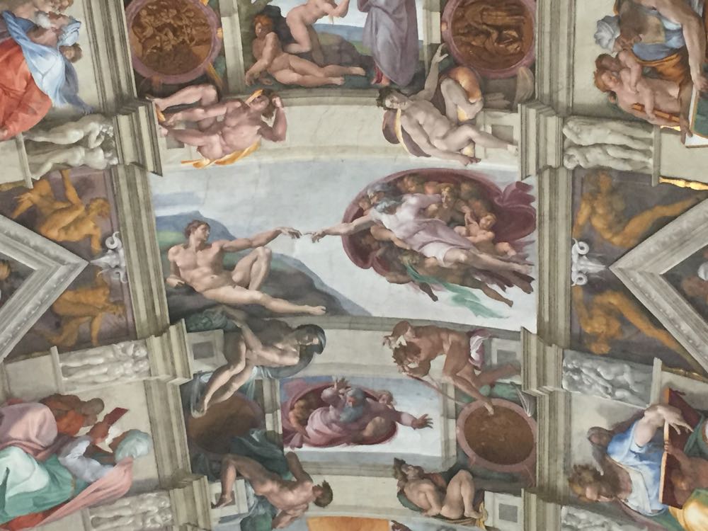 a ceiling with art on it