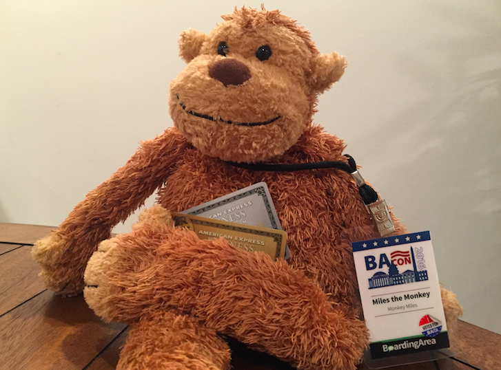 a stuffed animal holding a passport and a badge