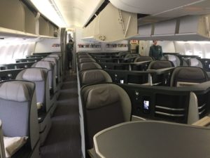 a plane with seats and people in the back