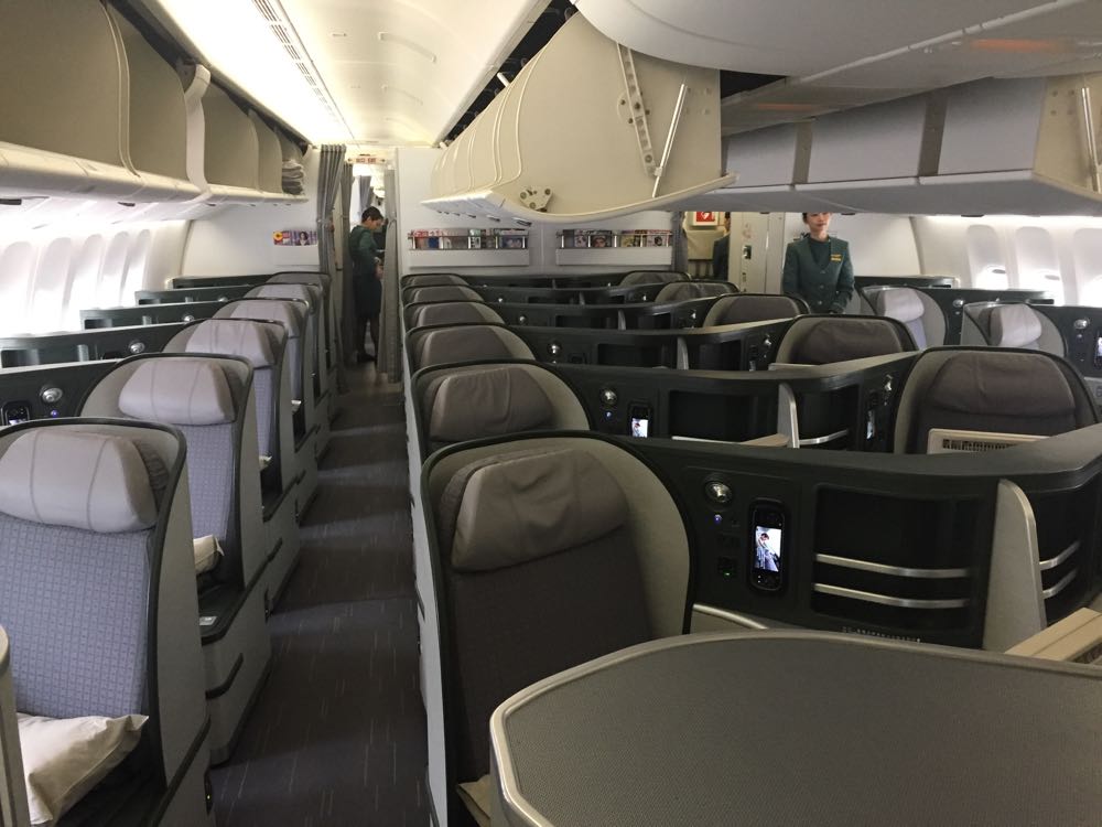 a plane with seats and people in the back