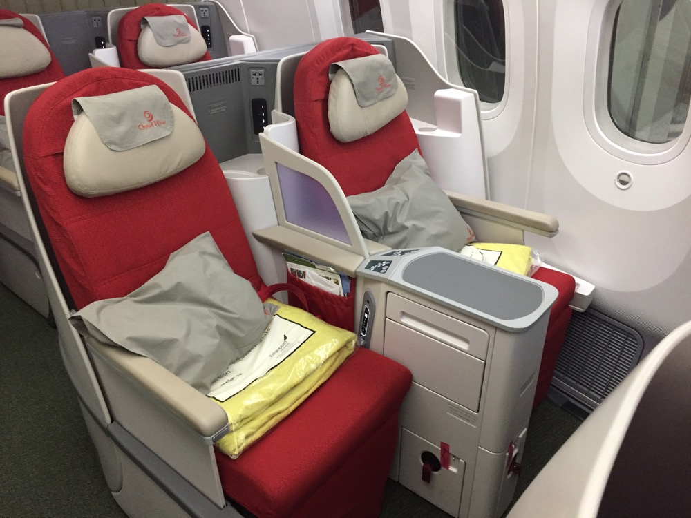 a red and white seats on an airplane