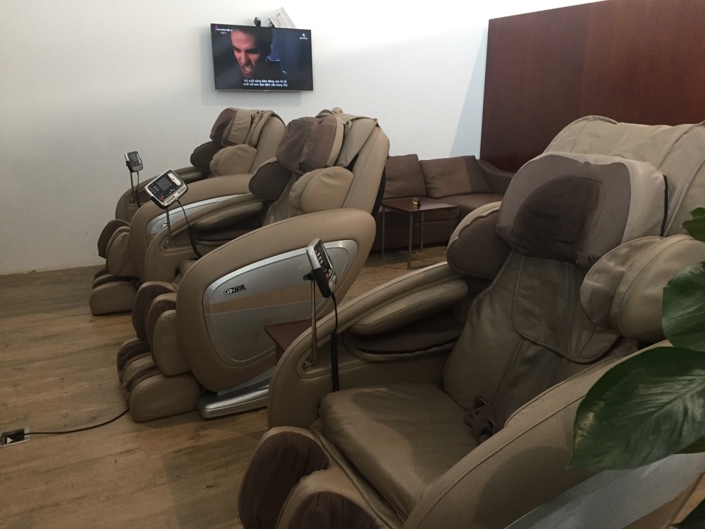 a group of brown massage chairs