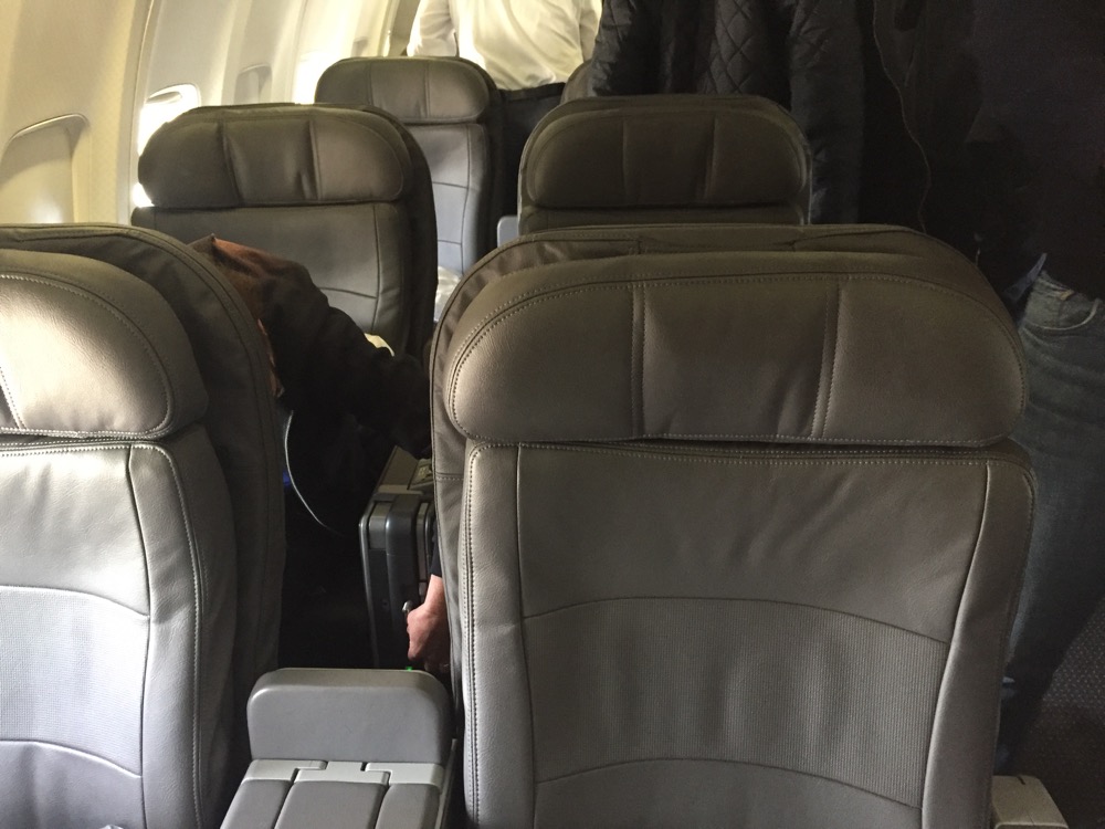 a person's head in the back of an airplane