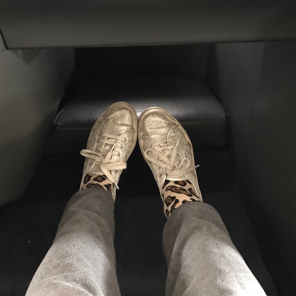a person's legs in a vehicle