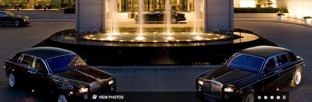 a car parked in front of a fountain