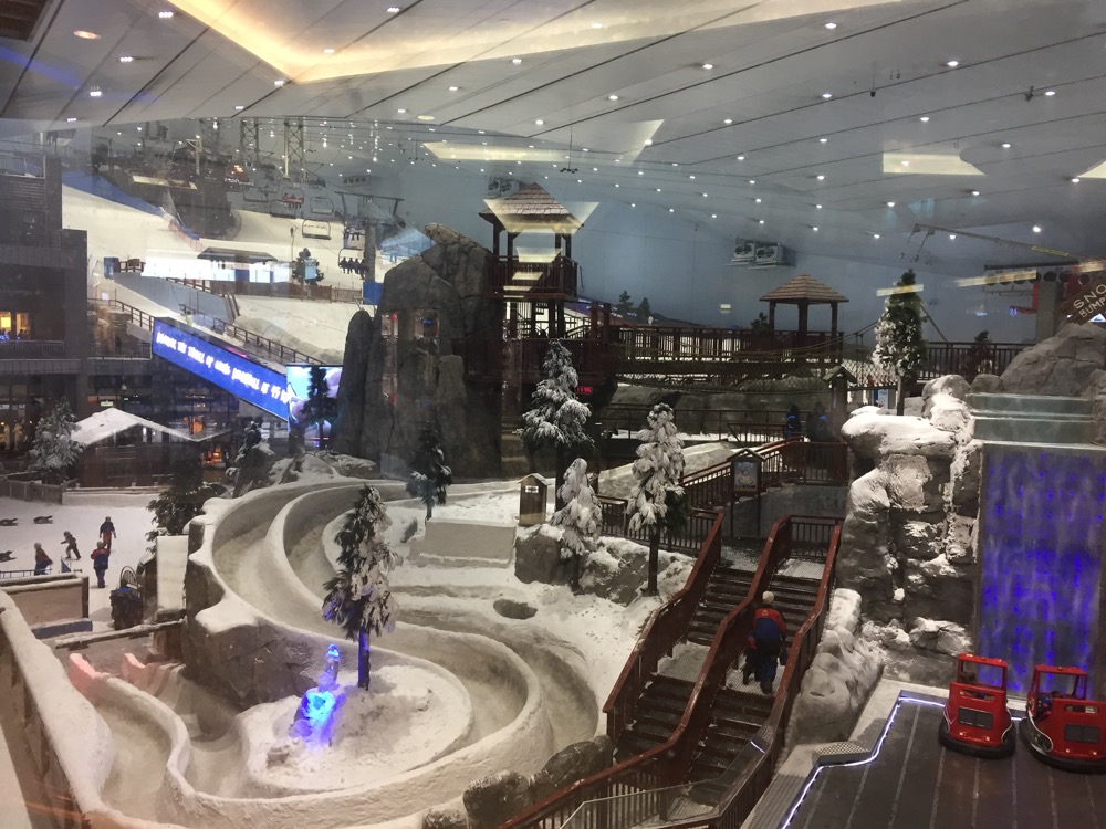 a snow covered indoor area with a toy car
