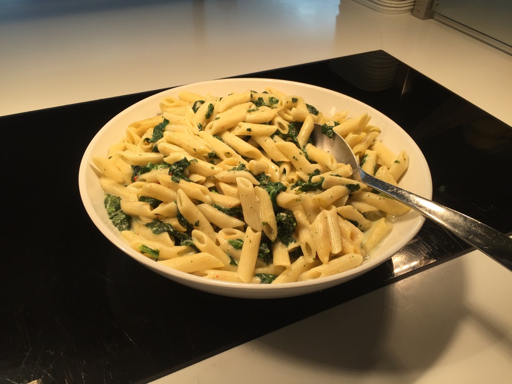 a bowl of pasta with a spoon