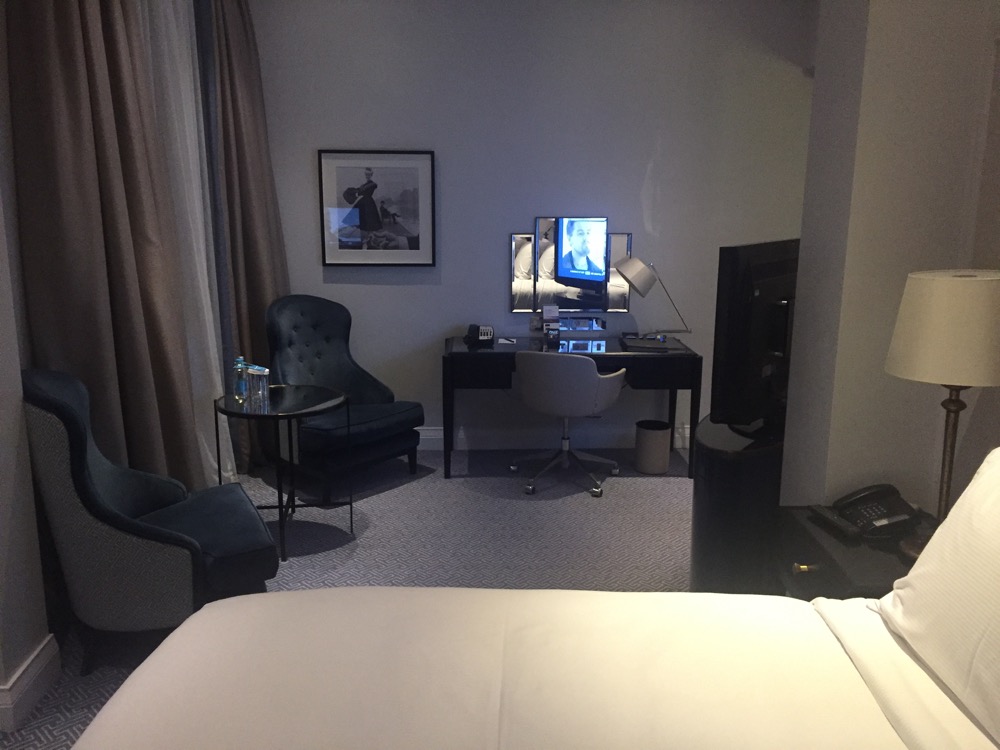 a room with a computer desk and chair