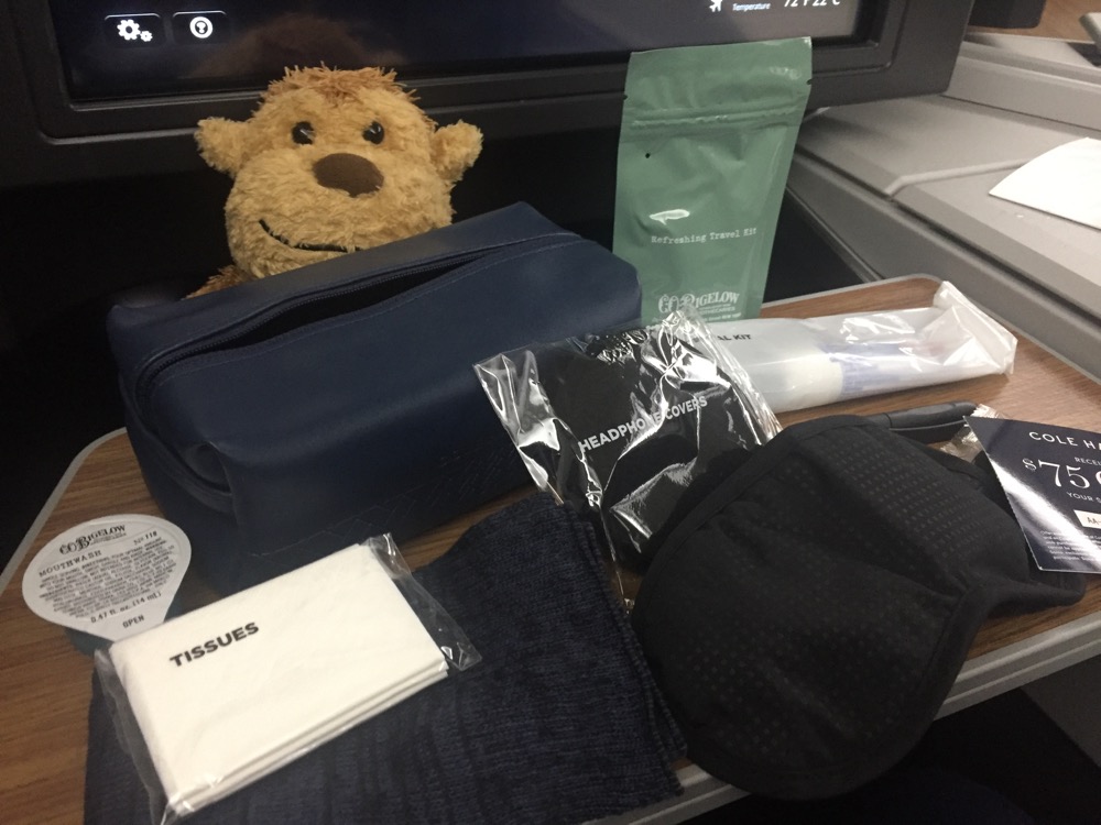 a stuffed animal next to a set of items