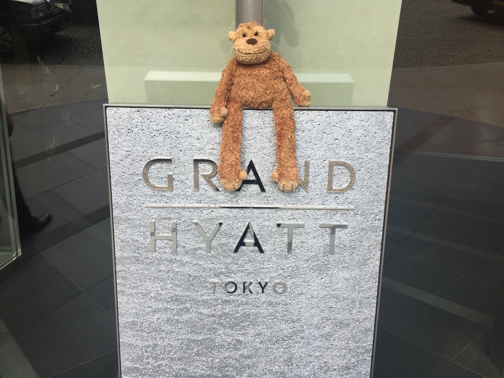 a stuffed animal on a sign