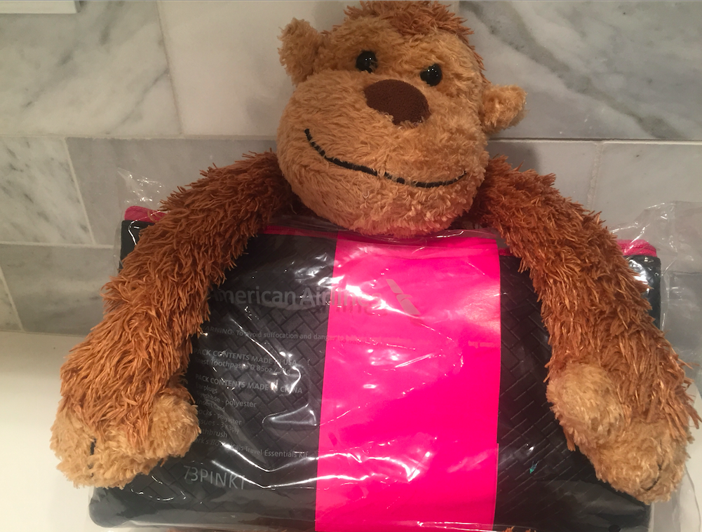 a stuffed monkey on a plastic bag