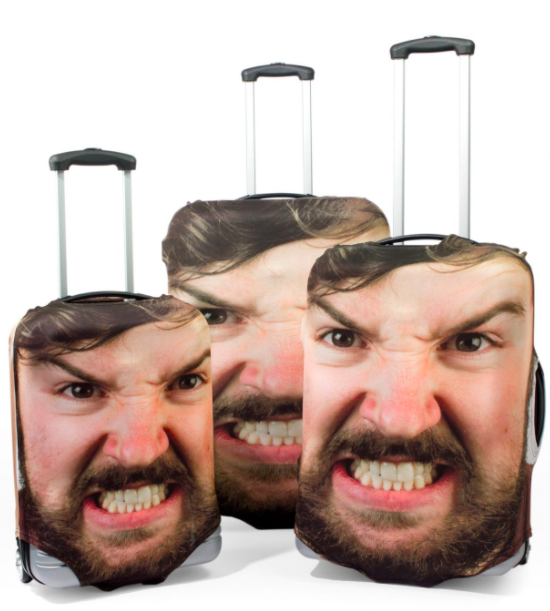 a group of luggage bags with faces on them
