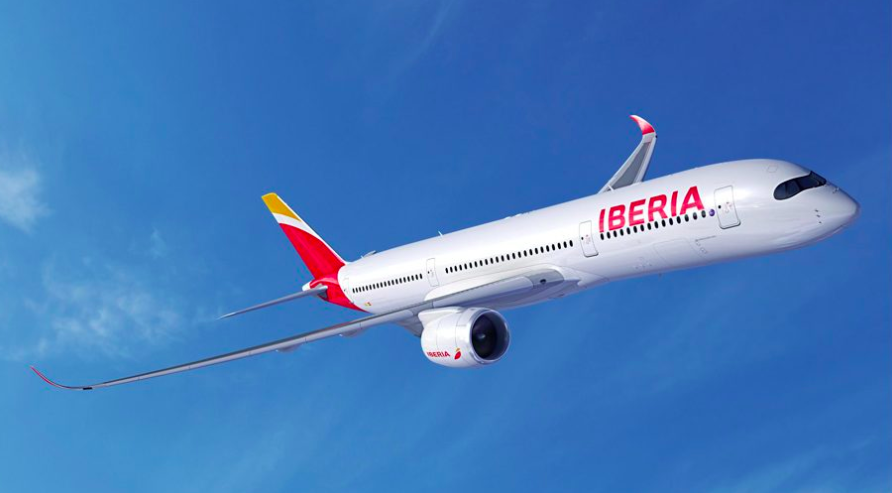 a white airplane with red and yellow text