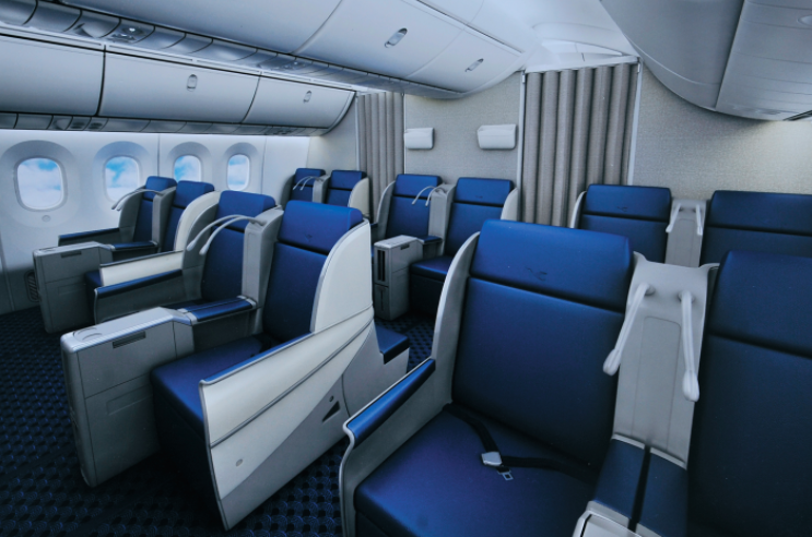 a blue and white seats in an airplane