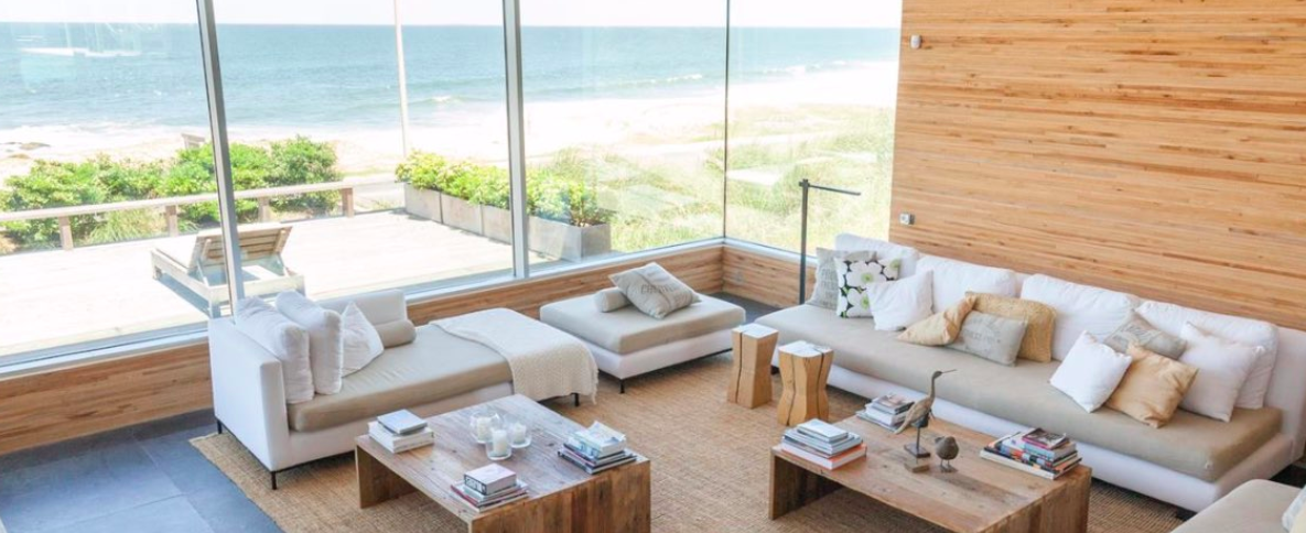 a room with a large window overlooking the ocean