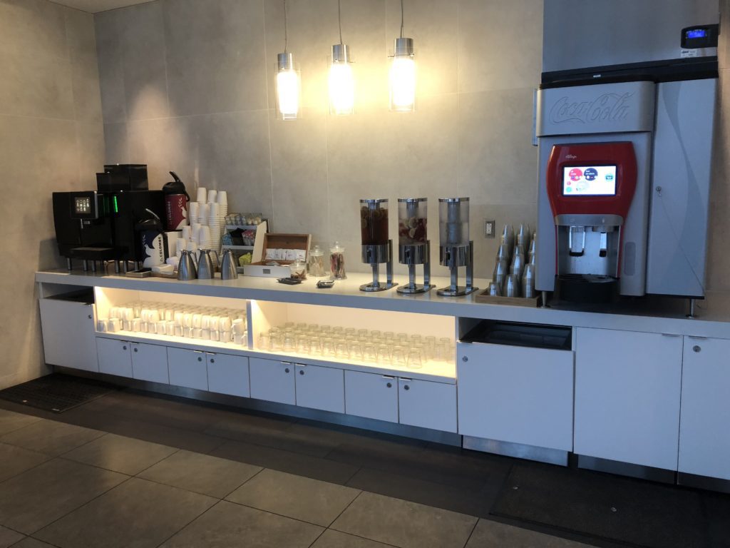 a counter with a machine and cups