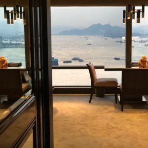 a room with a view of water and boats