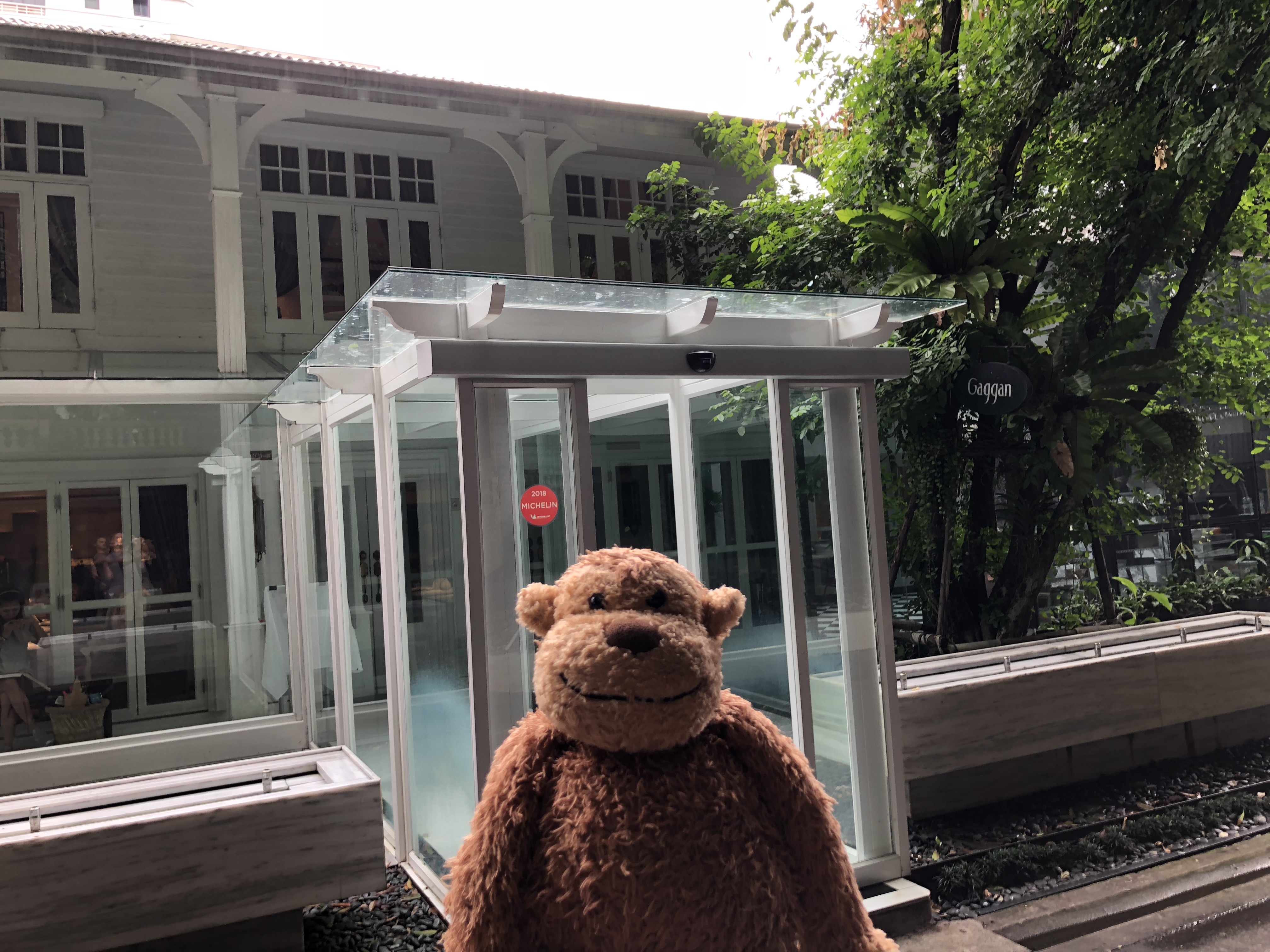 a stuffed animal in front of a building