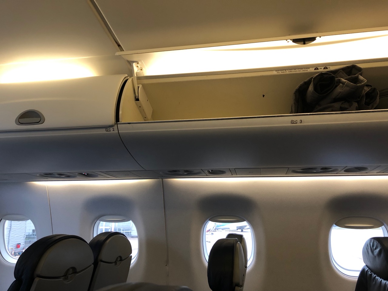 an airplane with windows and a shelf