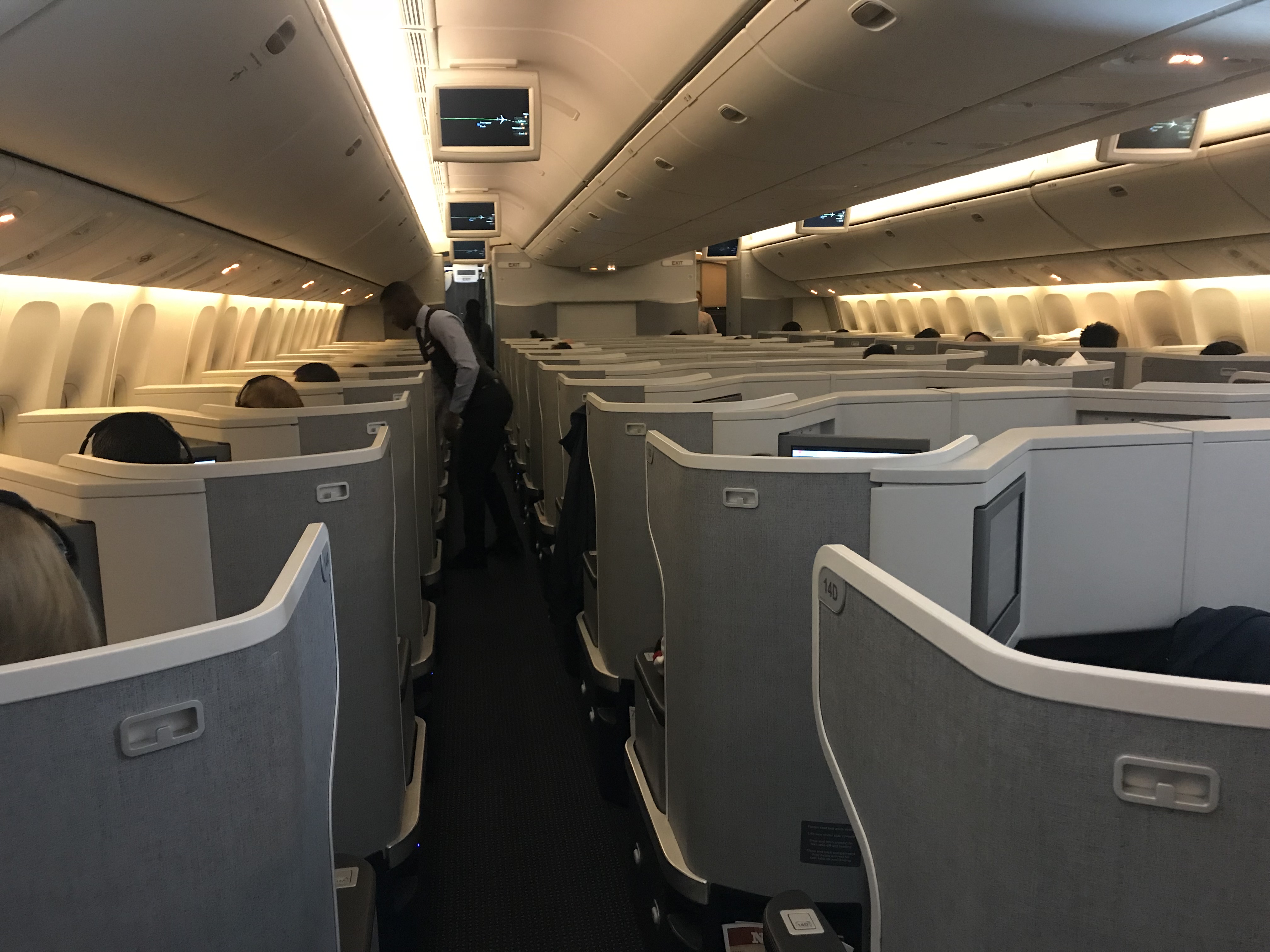 an airplane with seats and people in it