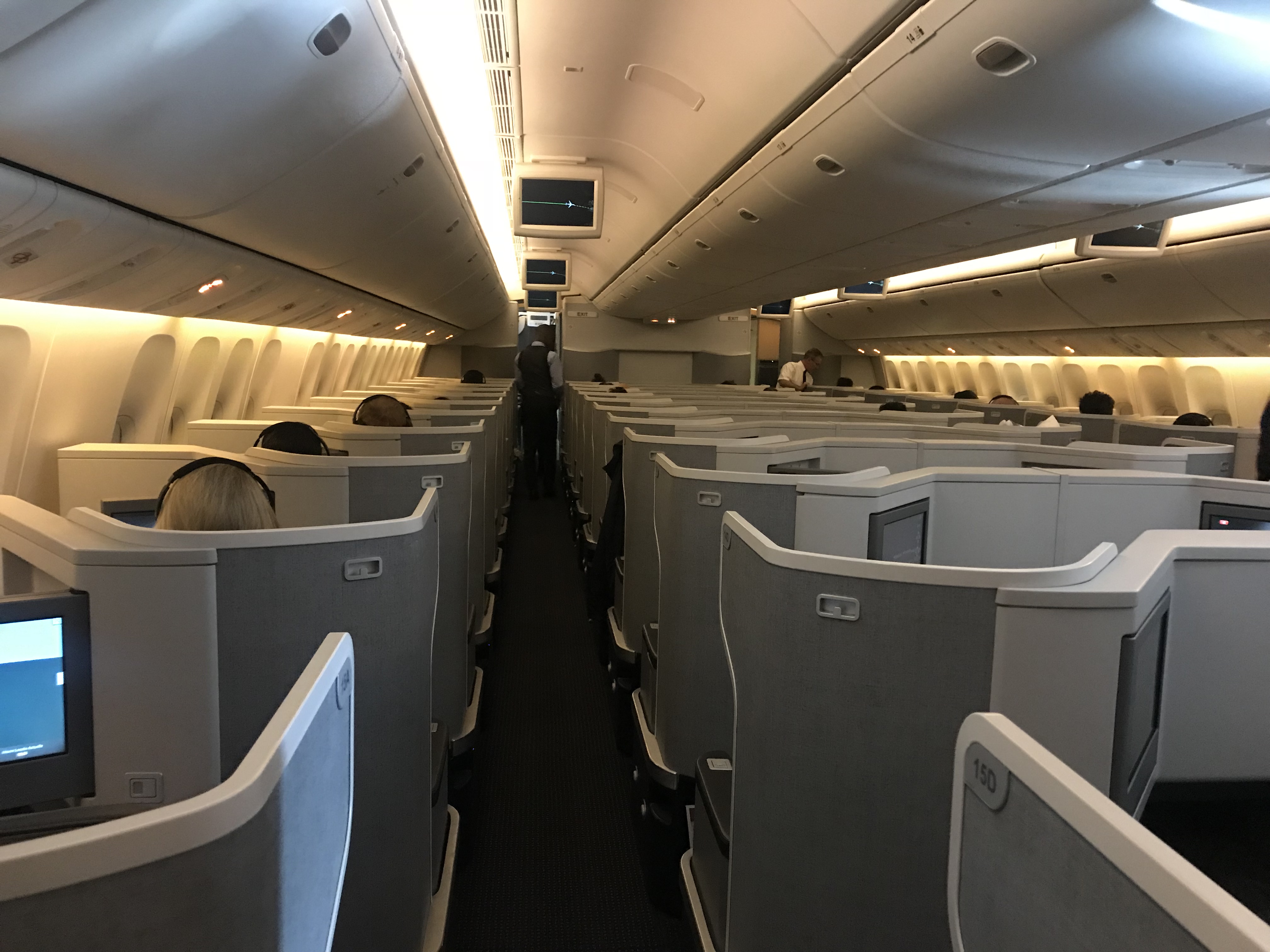 an airplane with seats and people in the back
