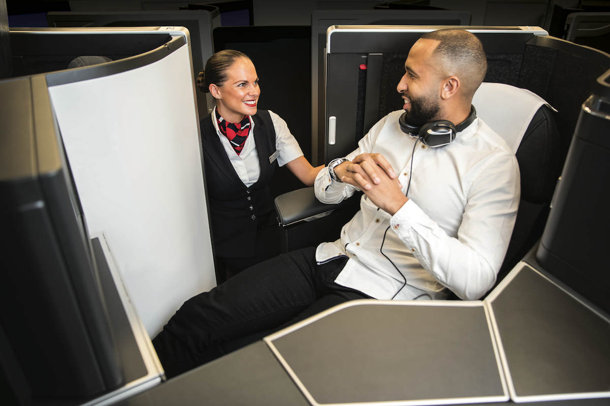 a man and woman in an airplane cabin