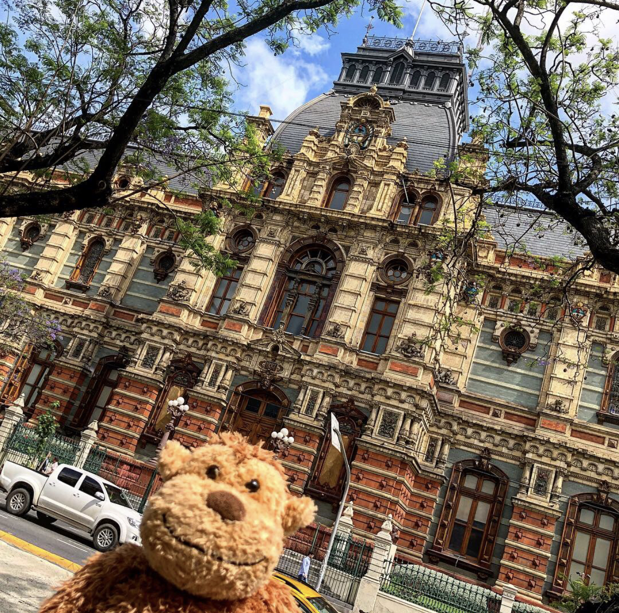 a stuffed animal in front of a building