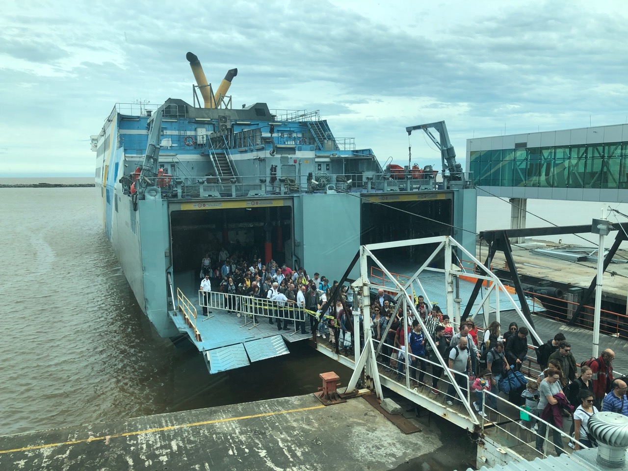 a group of people boarding a boat