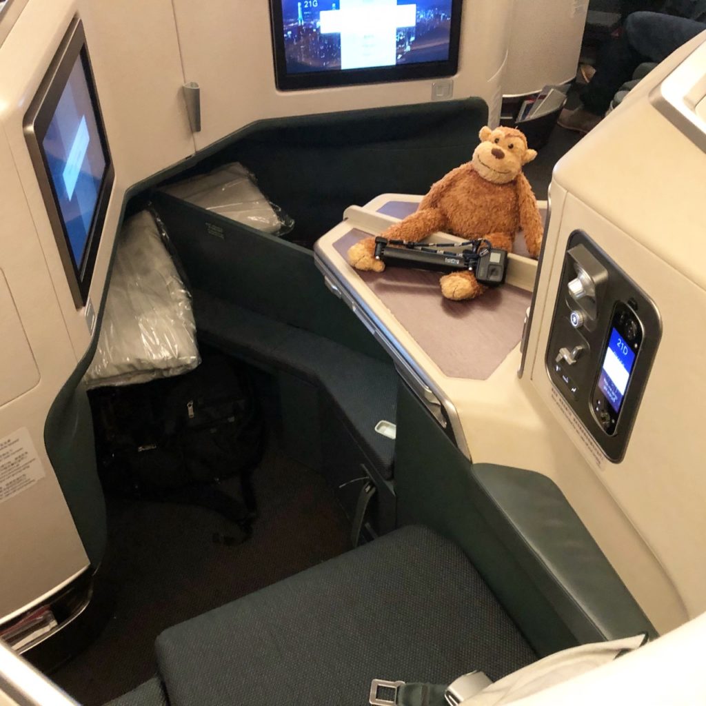 a stuffed animal on a table in a plane