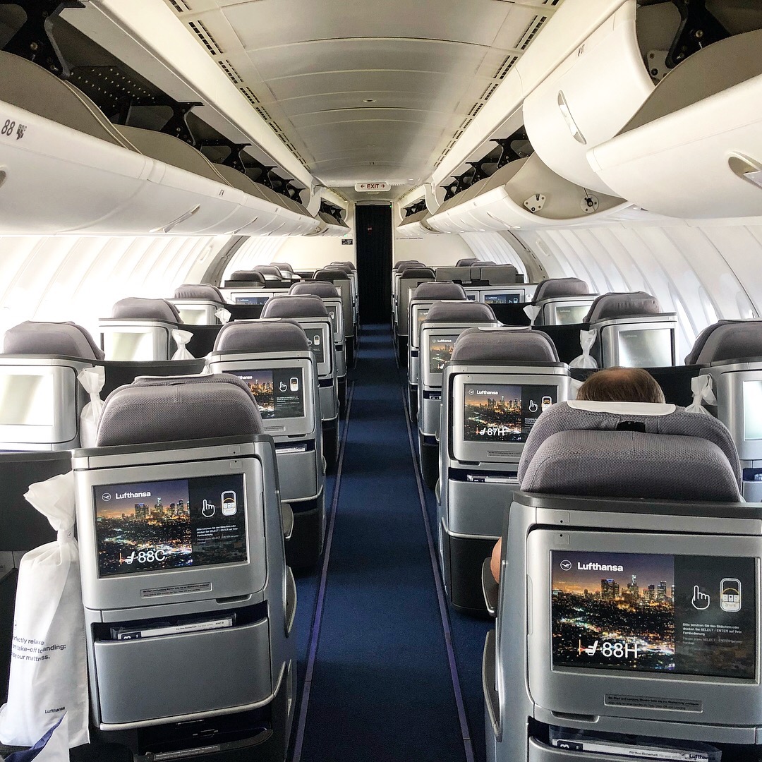 a plane with seats and monitors