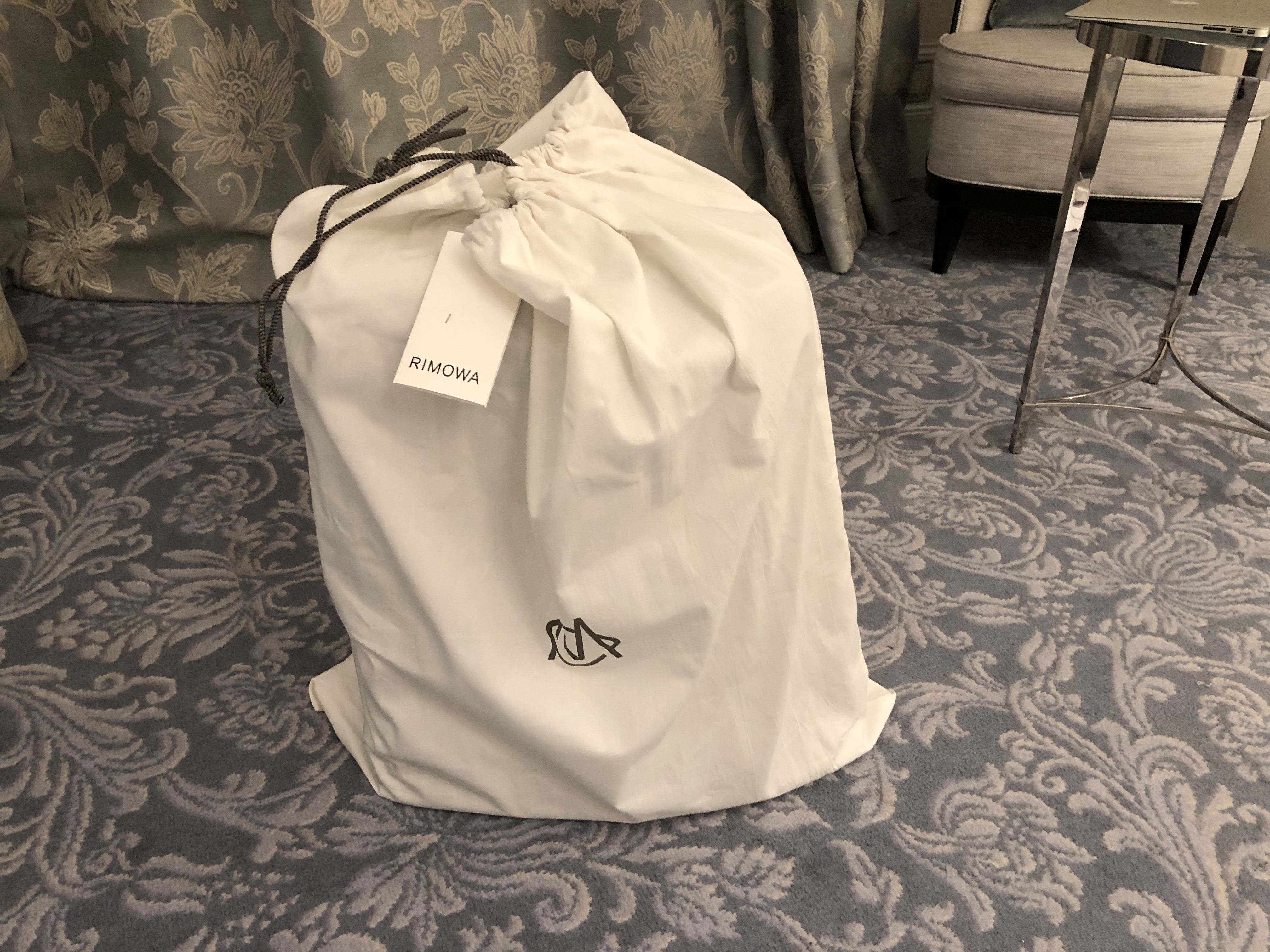 a white bag with a tag on it