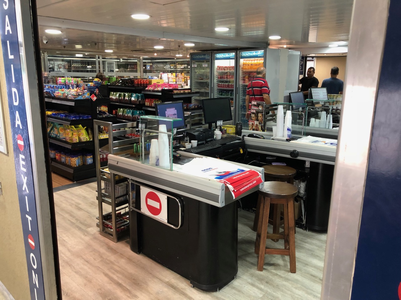a store with a cashier and shelves