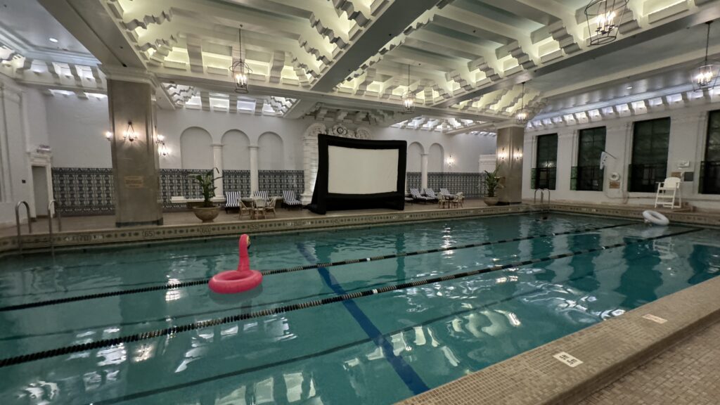 a swimming pool with a pink float in it