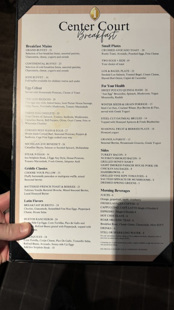 a hand holding a menu