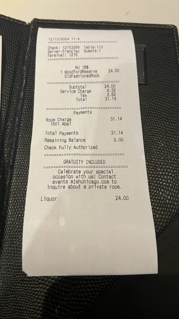 a receipt on a leather surface