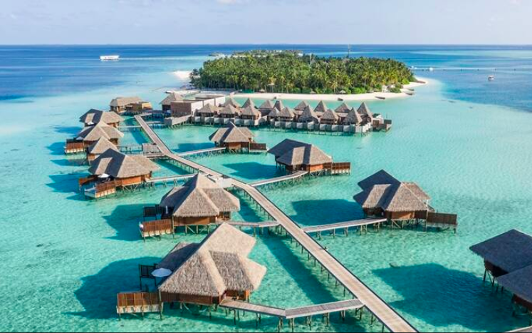 a group of huts on water